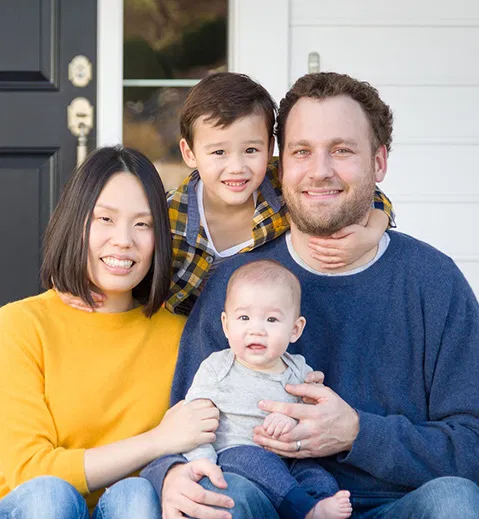 family of four smiling