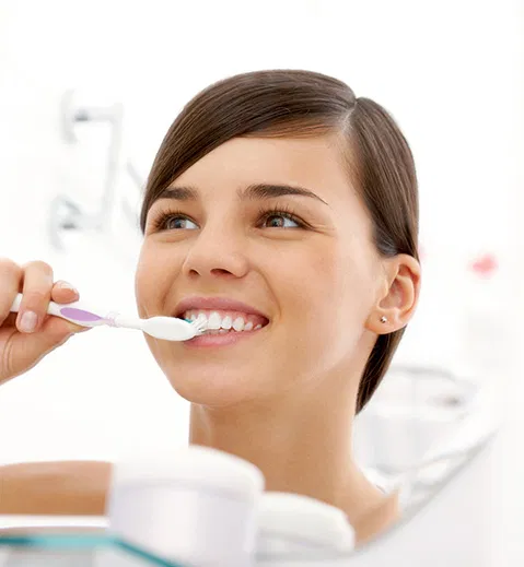 Woman brushing her teeth